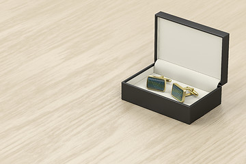 Image showing Box with golden cufflinks