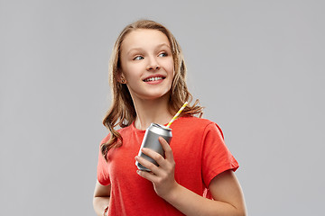 Image showing teenage girl holding can of soda with paper straw