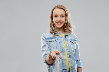 Image showing teenage girl taking picture by selfie stick