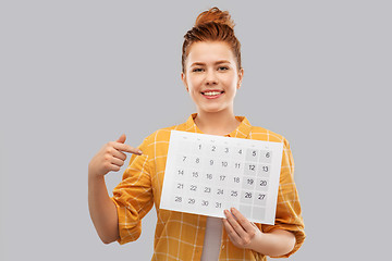 Image showing happy red haired teenage girl with calendar sheet