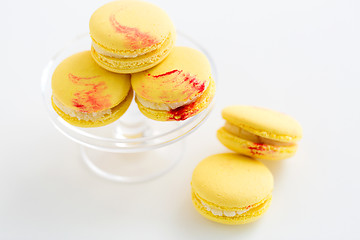 Image showing close up of yellow macarons on confectionery stand