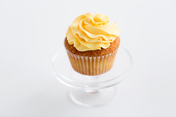 Image showing cupcake with frosting on confectionery stand