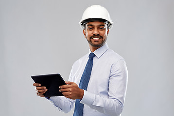 Image showing architect or businessman in helmet with tablet pc