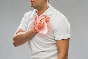 Image showing close up of man having heart attack or heartache