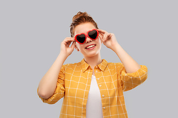 Image showing red haired teenage girl in heart-shaped sunglasses