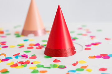 Image showing red birthday party cap and confetti