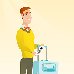 Image showing Caucasian businessman showing luggage tag.