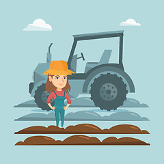 Image showing Farmer standing on the background of tractor.