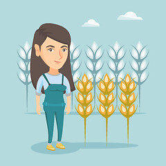 Image showing Young caucasian farmer standing in a wheat field.