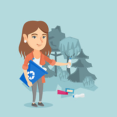 Image showing Caucasian woman collecting garbage in the forest.