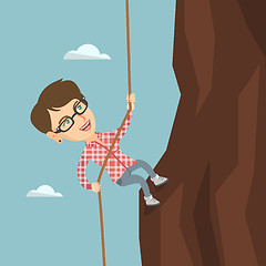 Image showing Caucasian business woman climbing the mountain.