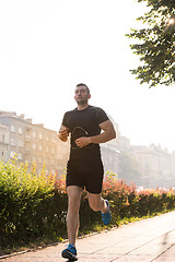 Image showing man jogging at sunny morning