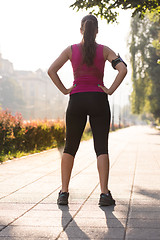 Image showing woman jogging at sunny morning