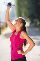 Image showing woman pouring water from bottle on her head