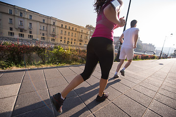 Image showing young couple jogging  in the city