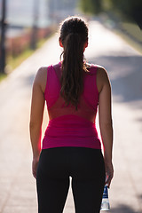 Image showing woman jogging at sunny morning
