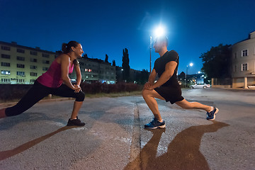 Image showing couple warming up and stretching