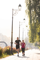 Image showing young couple jogging  in the city