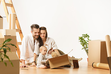 Image showing Couple moving to a new home - Happy married people buy a new apartment to start new life together