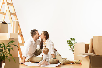 Image showing Couple moving to a new home - Happy married people buy a new apartment to start new life together