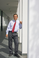 Image showing Businessman at an office building