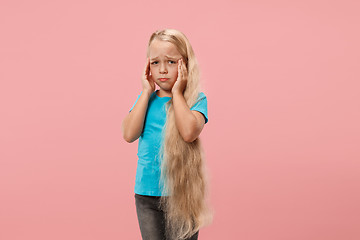 Image showing Girl having headache. Isolated over pink background.