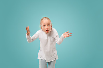 Image showing Beautiful female half-length portrait on studio backgroud. The young emotional teen girl