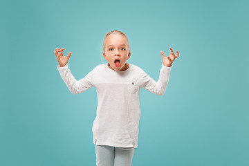 Image showing Beautiful female half-length portrait on studio backgroud. The young emotional teen girl