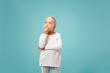 Image showing Young serious thoughtful teen girl. Doubt concept.