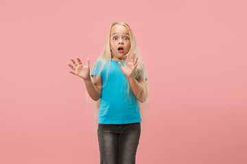 Image showing Portrait of the scared girl on pink