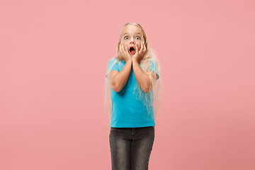 Image showing Portrait of the scared girl on pink