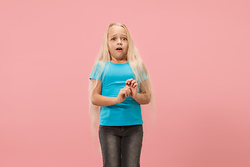 Image showing Portrait of the scared girl on pink