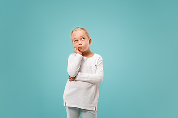 Image showing Young serious thoughtful teen girl. Doubt concept.