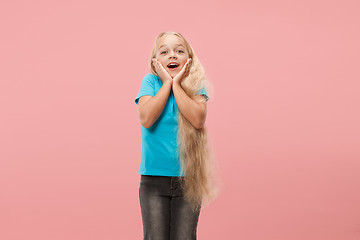 Image showing Beautiful teen girl looking suprised isolated on pink