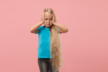 Image showing Girl having headache. Isolated over pink background.