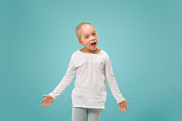 Image showing Beautiful female half-length portrait on studio backgroud. The young emotional teen girl