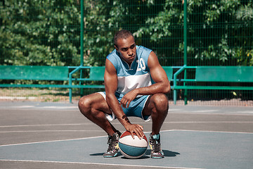 Image showing Picture of young resting african basketball player