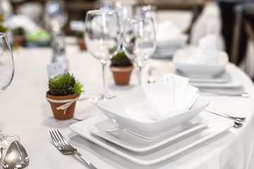 Image showing Plates and dishes on dining table