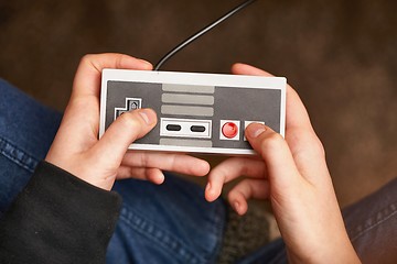 Image showing Playing an old gaming console