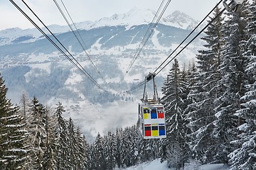 Image showing Skiing lift cabin over a valley