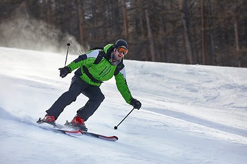 Image showing Skiing in the winter snowy slopes