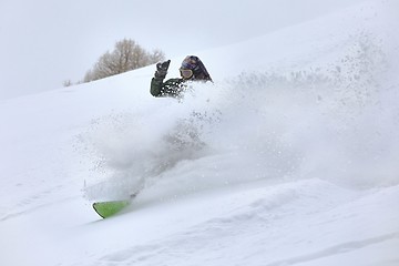 Image showing Snowboarding in fresh powder snow