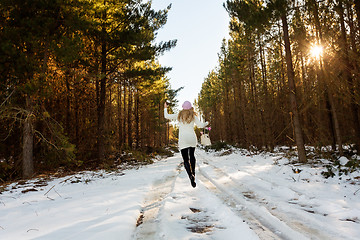 Image showing Frolicking in the snow among the forest trees