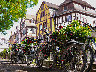 Image showing House facade with flowers and bicycles in Alsace, France