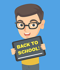 Image showing Schoolboy holding tablet with text back to school.