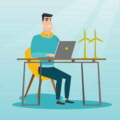 Image showing Man working with model of wind turbines.