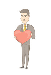 Image showing Caucasian businessman holding a big red heart.