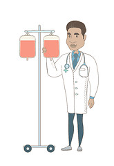 Image showing Young hispanic doctor preparing drop counter.