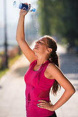 Image showing woman pouring water from bottle on her head