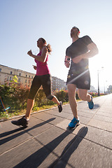 Image showing young couple jogging  in the city